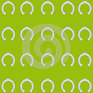 Horse shoe on green background.