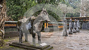 Horse and Stone mandarin sculptures in the forecort preceding the Stele Pavilion in Tu Duc Royal Tomb, Hue, Vietnam