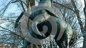 The horse tamer in public park Kleistpark In Berlin, Germany, Tilt up Shot