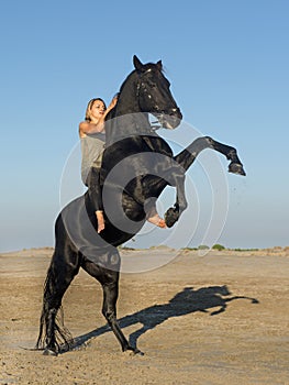 Horse woman and stallion photo
