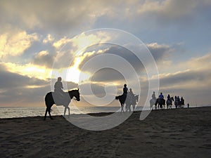 Horseback riding along the beach