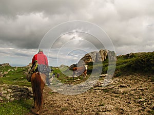 Horseback riding in the high mountain countryside