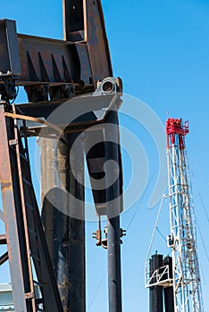 Horsehead pumpjack with a blue sky background photo
