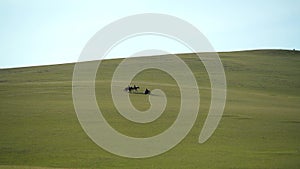 Horsemen and Motorcycle in Treeless Central Asian Steppes