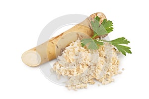 Horseradish root with slices grated pile and parsley isolated on white background