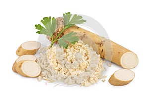 Horseradish root with slices grated pile and parsley isolated on white background