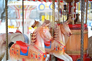 Horses carousel at the amusement entertainment park. Colorful carousel with horses, amusement park element. Children s