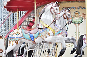 Horses carousel attraction. Festival holiday