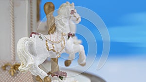 Horses Carousel toy spinning on blue background