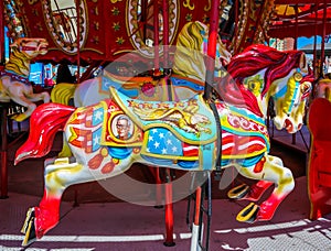 Horses on a Coney Island carousel in Luna Park at historic Coney Island Boardwalk in Brooklyn