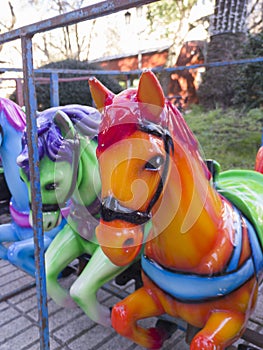 Horses out of merry-go-round placed on line