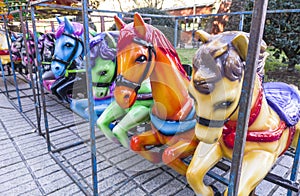 Horses out of merry-go-round placed on line