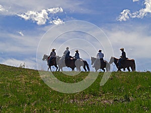 Horses and Riders on Ridge