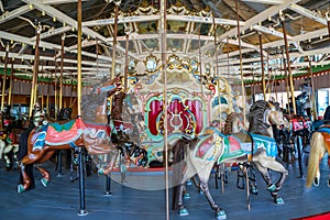 Horses on a traditional fairground B&B carousel at historic Coney Island Boardwalk in Brooklyn