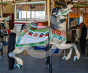 Horses on a traditional fairground B&B carousel at historic Coney Island Boardwalk in Brooklyn