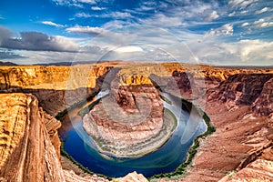 Horseshoe Bend on Colorado River at Beautiful Sunrise with Bright Blue Sky, Utah