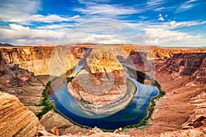 Horseshoe Bend on Colorado River at Beautiful Sunrise with Bright Blue Sky, Utah