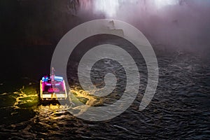 Horseshoe Fall, Niagara Gorge and boat in mist at night, Niagara Falls, Ontario, Canada. High quality photo