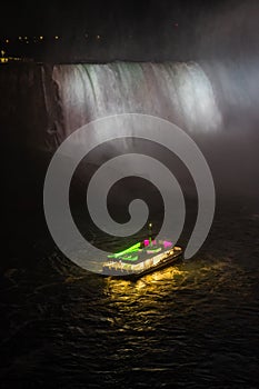 Horseshoe Fall, Niagara Gorge and boat in mist at night, Niagara Falls, Ontario, Canada. High quality photo