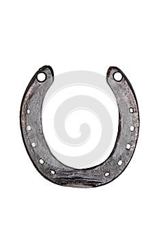 Horseshoe isolated. Close-up of metal horse shoe as a symbol of good luck, prosperity and of a happy future isolated on a white