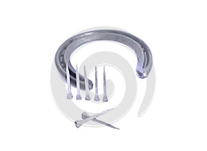 Horseshoe and nails isolated on a white background