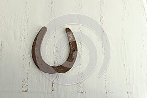 Horseshoe on a white shabby chic background