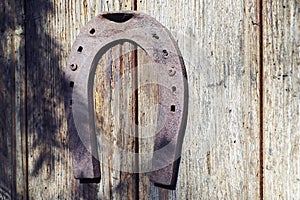 Horseshoes oxides on wooden door