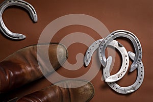 Horseshoes and a pair of leather shoes