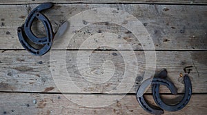 Horseshoes on wooden surface wallpaper