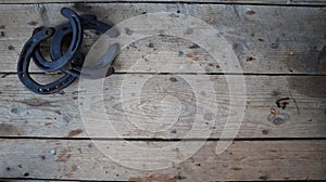 Horseshoes on wooden surface wallpaper