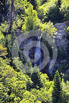 Horsetail Falls cascade down the cliffs in Lone Peak Wilderness along the Wasatch Front Rocky Mountains, Alpine Utah. photo