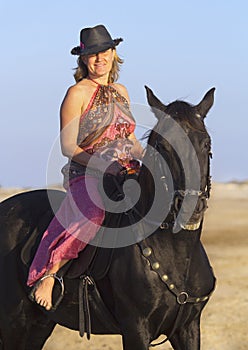 Horsewoman on the beach