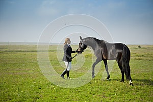 Horsewoman trains the horse photo