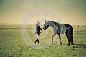 Horsewoman trains the horse / split vintage toned photo