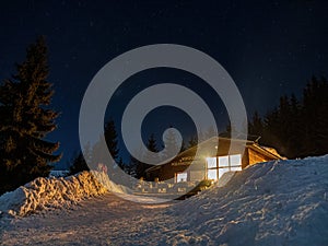 Horska Chata pod Kalovou Holou during winter starry sky photo