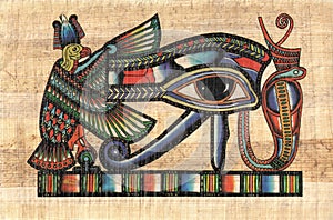 Horus ancient eye on papyrus paper photo