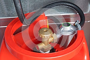 Hose connected to the cylinder red gas supply