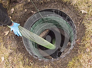 Hose pumping out home septic tank