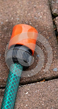 Hosepipe isolated on a paved surface