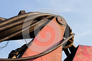 hoses and tubes of the hydraulic system from heavy machinery - Machine to hammer the piles in the construction road junction in M