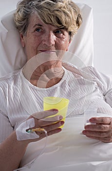 Hospice patient taking painkillers photo