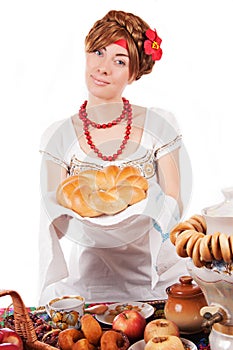 Hospitable russian woman offering traditional loaf