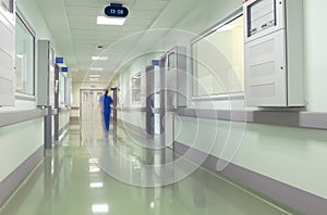 Hospital corridor with blurred figures of the medical staff