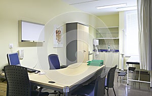 Hospital doctor room with equipment and desk