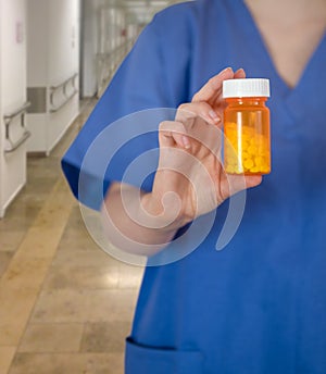 Hospital Doctor In Scrubs With Medication