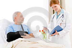 Hospital - female doctor examine senior patient