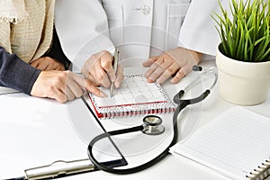 Hospital and health care concept, Doctor and patient make an appointment for follow up plan. photo