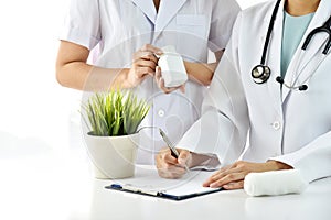 Hospital and Healthcare staff, Professional medical care provider, Doctor writing note for treatment. photo