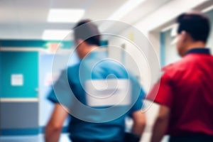 Hospital interior. Doctors saving patients\' lives. Blurry background.