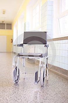 Hospital invalid chair on hospital corridor